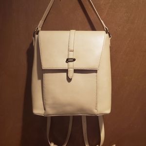Nude/light pink backpack style purse.
